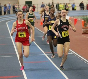 Holliston's Sydney Snow (left) and Watertown's Lea Strangio battle down the stretch in the 600 at the Division 4 state indoor track championships Sunday, Feb. 16, 2014, at the Reggie Lewis Center.