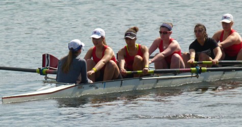 The author (third from left, in black visor) practices on the Charles River with her teammates from Community Rowing in Brighton.