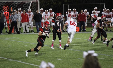 Austin Farry (left) and Nick Girodano (8) had the Melrose defense running every which way during Watertown's 28-26 victory on Oct. 10, 2014, on Senior Night at Victory Field.