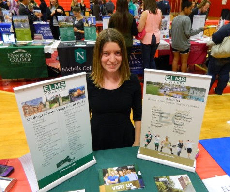 Kate Kelly, admissions counselor at Elms College, at the annual College Fair at Watertown High School on Oct. 9, 2014. 