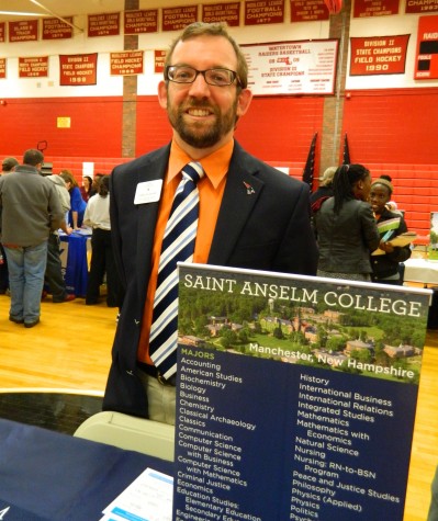 Daniel Richer representing Saint Anselm College at the annual College Fair at Watertown High School on Oct. 9, 2014. 