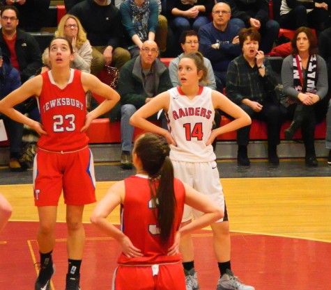 Gianna Coppola (14) and the rest of the Watertown High girls' basketball team had a hard time with Tewksbury and forward Molly Robertson (23) during their Division 2 North game on Thursday, Feb. 26, 2015. The undefeated Raiders won, 49-45, to advance to the sectional semifinals against Belmont on Tuesday, March 3, at Mystic Valley High in Malden.