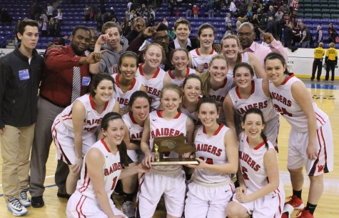The Watertown girls' basketball team poses with the MIAA Division 2 North championship trophy at Tsongas Center in Lowell on Saturday, March 7, 2015. The Raiders beat Pentucket, 44-40, to advance to the Eastern Mass. title game against Duxbury on Tuesday, March 10, at TD Garden.  