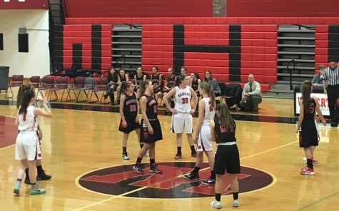 Tipoff at the Watertown High girls' basketball home opener vs. Winchester on Friday, Dec. 18, 2015.