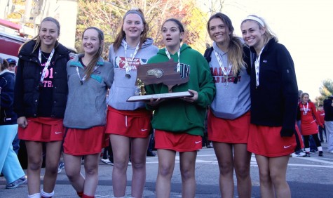 The seniors on the 2015 Watertown field hockey team celebrate at the high school after winning the MIAA Division 2 state championship on Saturday, Nov. 21, in Worcester. The Raiders beat Auburn, 6-0, for their seventh straight MIAA state championship while extending their national-record unbeaten streak to 160 games.