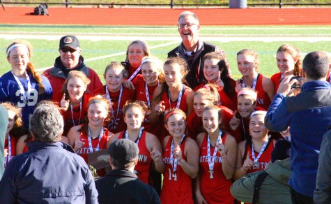 Members of the Watertown field hockey team celebrate after winning the MIAA Division 2 state championship on Saturday, Nov. 21, 2015, in Worcester. The Raiders beat Auburn, 6-0, for their seventh straight MIAA state championship while extending their national-record unbeaten streak to 160 games.