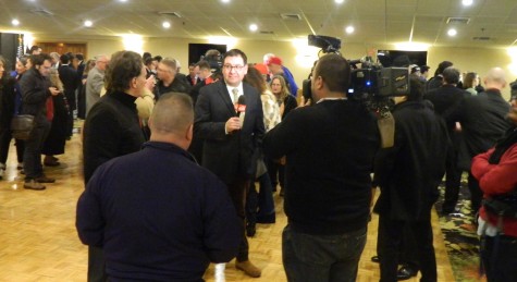 Reporters interview supporters following a speech by presidential candidate Donald Trump at the post-election party at Executive Court Banquet Facility in Manchester, N.H., on Feb. 9, 2016, following the New Hampshire primary.