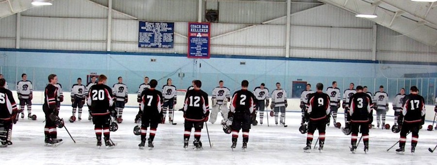 The Watertown and Belmont hockey teams take part in the opening ceremonies at Skip Viglirolo Skating Rink in Belmont prior to their game on Jan. 27, 2016.