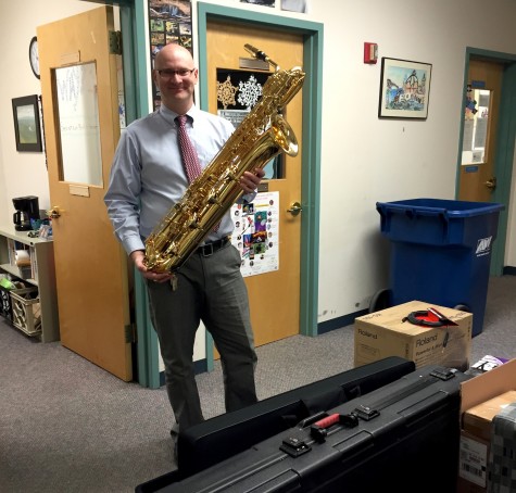 Dan Jordan -- who teaches music throughout the Watertown Public School system -- poses with some of the instruments purchased with the recent grant from Music Drives Us.