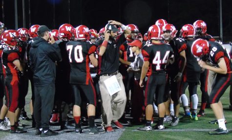 Coach John Cacace (center) led Watertown High against Wakefield in a Middlesex League football game at Victory Field on Sept. 23, 2016.