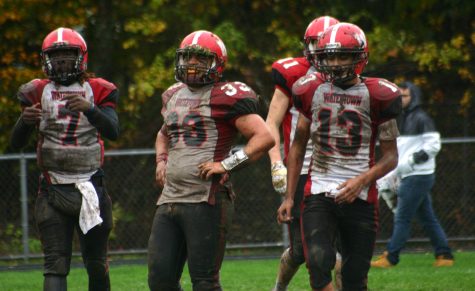 Deon Smith (7), Zach Rimsa (33), and Yoseph Hamad (13) got down and dirty to help Watertown beat host Stoneham, 16-8, in overtime on Saturday, Oct. 22, 2016. With the win, Raiders improved to 6-1 and earned a top seed in the MIAA Division 3 North playoffs.