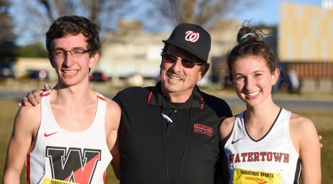Watertown High senior James Piccirilli (left) and junior Emily Koufos (right) pose with Raiders coach Tom Wittenhagen at the Division 2 MIAA all-state cross-country meet Nov. 19, 2016, in Gardner. 