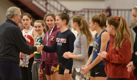 Watertown High junior Emily Koufos accepts her medal after finishing 12th in the Division 2 girls' MIAA all-state cross-country meet Nov. 19, 2016, in Gardner. She finished the 5K course in 19 minutes 48 seconds. 