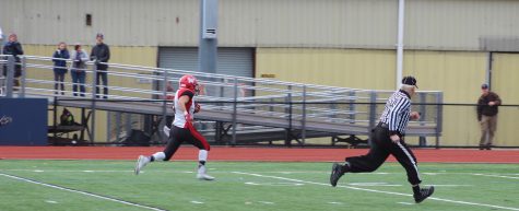 Vasken Kebabjian takes off for one of his three touchdown runs during Watertown's 34-28 victory at Thanksgiving rival Belmont on Nov. 24, 2016.