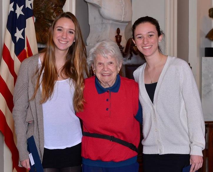 Mary Pratt of the  All-American Girls Professional Baseball League poses with Lea Strangio (left) and Jessica Lampasona representing Watertown High School at the National Girls & Women in Sport Day held  Feb. 7 in Faneuil Hall. 