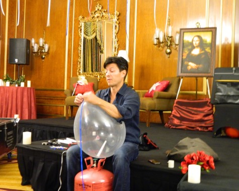 Ivan Amodei prepares one of his illusions before a recent performance at the Boston Park Plaza.