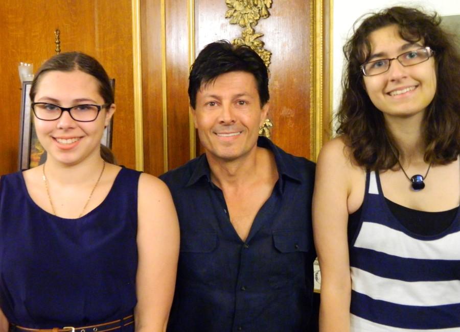 Magician Ivan Amodei (center) poses with Raider Times reporters before a recent performance at the Boston Park Plaza.