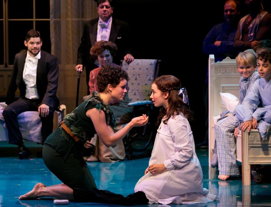 Peter Pan (Melanie Moore) and Wendy (Emma Pfaeffle) share a kiss in the production of the musical Finding Neverland at the A.R.T. in Cambridge.