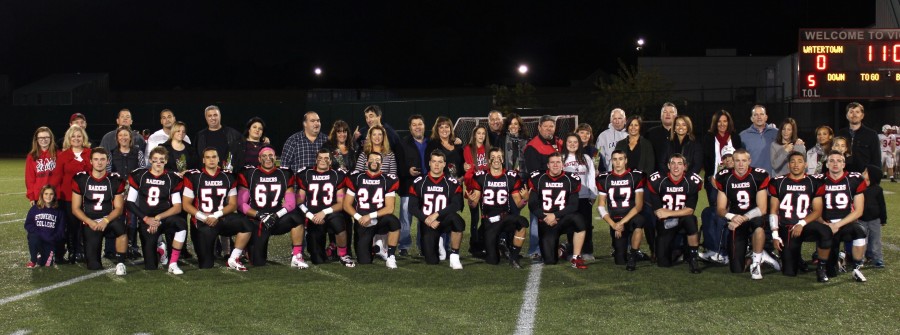 The seniors on the Watertown High School football team and their families pose on Victory Field prior to their last regular-season home game, a 28-26 victory over Melrose on Oct. 10, 2014. 