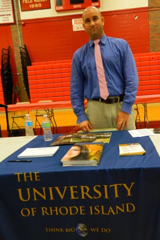 Eric Simonelli representing the University of Rhode Island at the College Fair at Watertown High School on Oct. 9, 2014. 