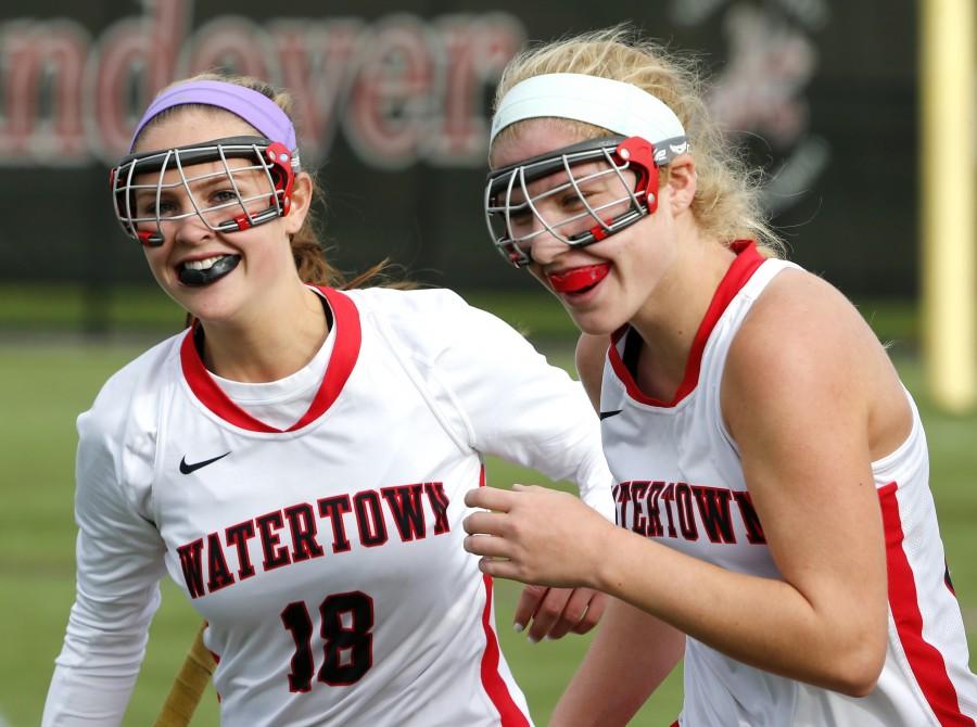 Watertowns Aurora Fidler (18) and Rachel Campbell are all smiles after defeating Weston, 2-0, in the Div. 2 North field hockey final in North Andover, Mass., on Sunday, Nov. 9, 2014. Watertown advanced to the state semifinal on Tuesday, Nov. 11, 2014.