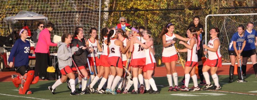 The 2014 Watertown field hockey team celebrates after capturing the Division 2 Eastern Mass. title with a 4-0 defeat of Dover-Sherborn on Nov. 11, 2014, at Reading High.