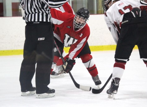 Watertown junior Mike Giordano prepares for a faceoff Wednesday, Dec. 17, 2014, during the Raiders' 3-0 season-opening loss to Arlington at Ryan Arena.