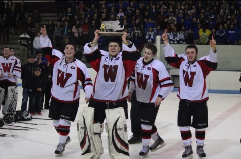 Watertown High senior captains (from left) Brendan Berkeley, Anthony Busconi, Nick Giordano, and Austin Farry celebrate the Raiders' first Division 3 North championship after their 2-1 victory over Bedford at Chelmsford Arena in Billerica on Friday, March 6, 2015. 
