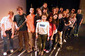 The cast of The Pajama Game takes a break from rehearsal to pose on the Watertown High stage. The cast will be in full costume this week when the curtain goes up on the WHS spring musical Thursday, March 19, through March 21, 2015.
