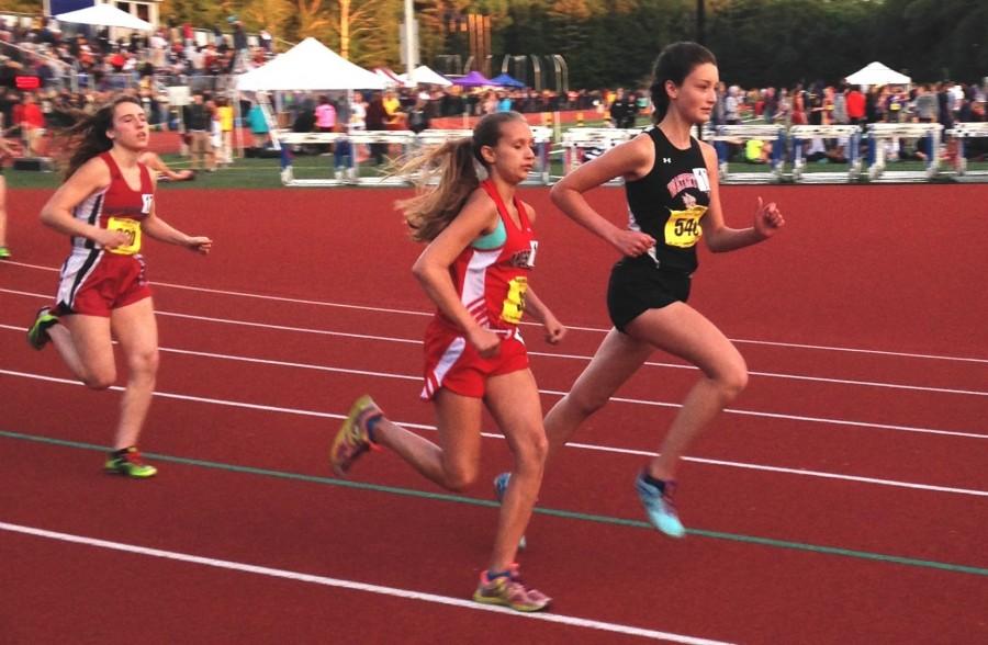 Watertown High freshman Elizabeth Powderly (right) competes at the MIAA Division 4 track championships in Norwell on Wednesday, June 3, 2015. Powderly set a Watertown High record with her time in the 2 mile, finishing in 11:53.65.
