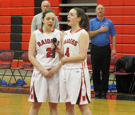 Junior Hanna and Jenna McMahon sing the nation anthem prior to Watertown's 52-33 win over visiting Danvers in the MIAA Division 2 North tournament game Friday, March 4, 2016. 