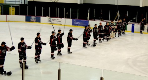 The Watertown High hockey team gives a salute during introductions before the Raiders played Northeast Regional in their MIAA Division 3 North game March 3, 2016, in Billerica. Watertown won, 3-0. 