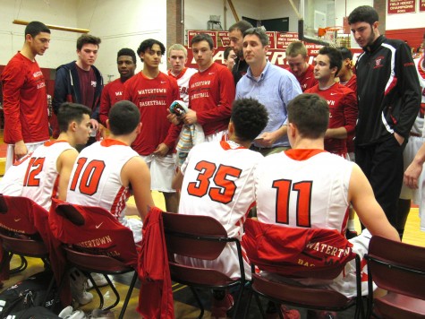 Watertown High players listen to coach Steve Harrington during the Raiders' 76-48 victory in Ipswich in the first round of the Division 3 North sectional on Tuesday, March 1, 2016. 