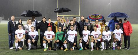 The senior members of the Watertown High boys' soccer team pose with their families during Senior Night festivities, Oct. 21, 2016, at Victory Field. 