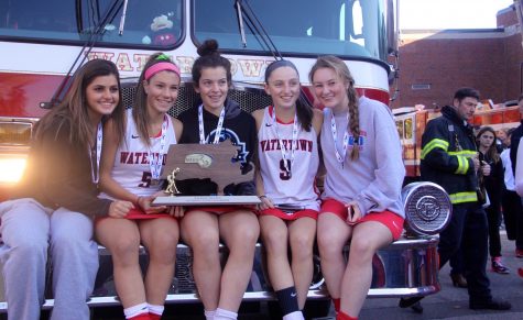 Members of the Watertown High School field hockey team pose with the MIAA Division 2 state title on Nov. 19, 2016. The Raiders defeated Oakmont, 4-3, at WPI for their eighth straight state championship.