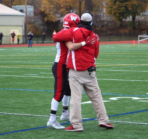 Coach John Cacace (right) congratulates Vasken Kebabjian, who scored three touchdowns run during Watertown's 34-28 victory at Thanksgiving rival Belmont on Nov. 24, 2016.