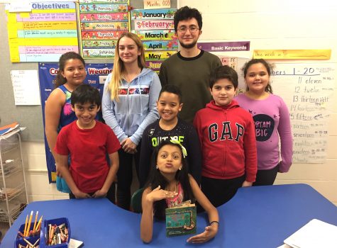 Students from Watertown High School (standing center) volunteer with STAR program for ELL students at Cunniff Elementary School in Watertown, Mass.