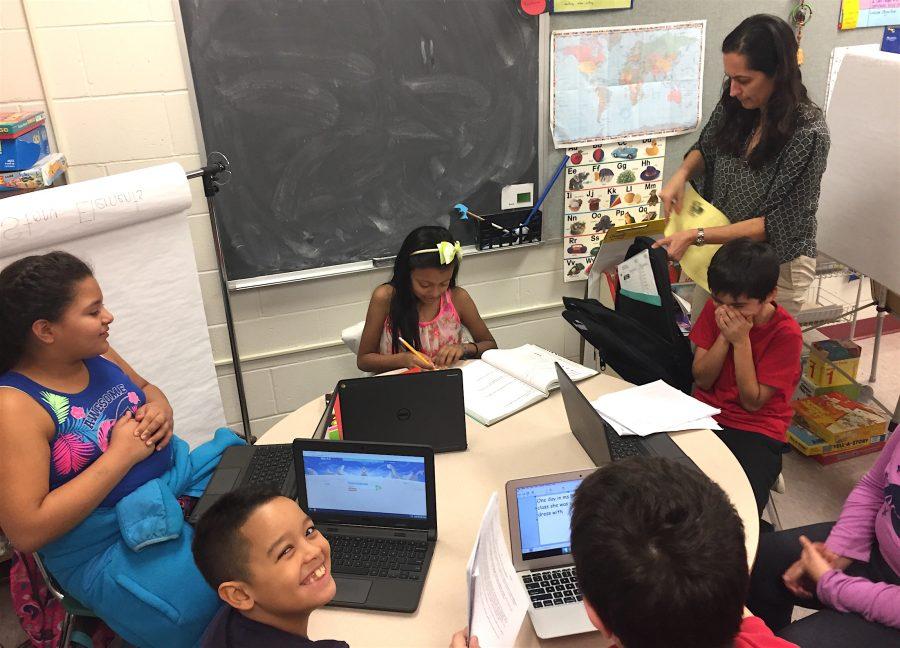 Helda Shirinian (standing) leads the STAR program for ELL students three times a week after school at Cunniff Elementary in Watertown, Mass. 