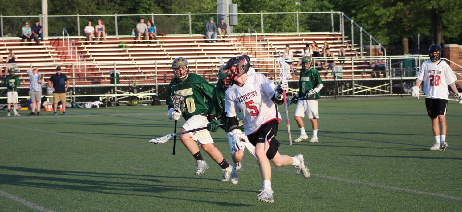 Luke Murphy (5) and the Raiders lacrosse team defeated Matignon, 15-8, on May 19, 2017, at Watertown High’s Victory Field.