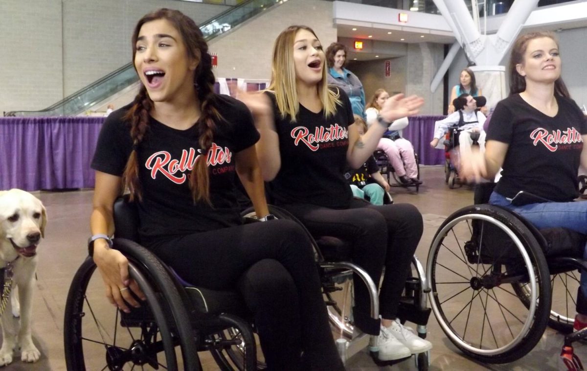 Stephanie (left), Samantha (center), and Maria are part of the Rollettes dance team, which performed at the 2017 Boston Abilities Expo at the Boston Convention and Expo Center. 
