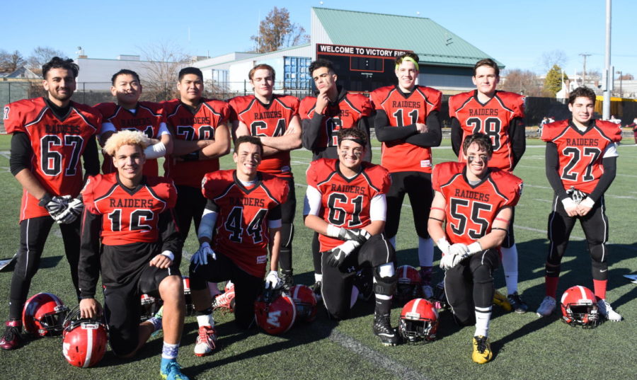 Members of the Watertown High football team pose on Victory Field after being Belmont, 35-16, in their annual football game on Thanksgiving morning Nov. 23, 2017. 