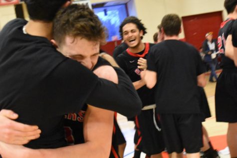 Watertown celebrates its 66-61 victory over Burke in the Division 3 Eastern Mass. championship game March 13, 2018, in Burlington. 