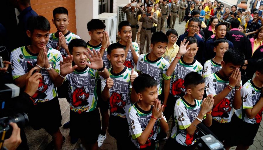 The 12 members of the Wild Boars soccer team and their coach arrive for a news conference in Chiang Rai, Thailand.