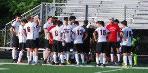 The Watertown boys soccer team talks strategy during the Raiders game with Arlington on Thursday, Sept. 13, 2018.