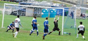 Watertowns Justin Viasus beats the Stoneham keeper as the Raiders boys soccer team defeated Stoneham, 5-2, on Saturday, Oct. 20, 2018. 