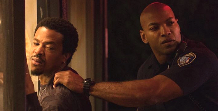 Russell Hornsby (left) in The Hate U Give.