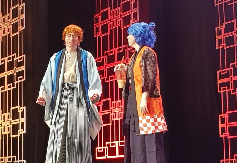 Anime Boston mascots B-kun (left) and A-chan helped get the crowd in the mood during opening day at Hynes Convention Center on Friday, April 19, 2019.