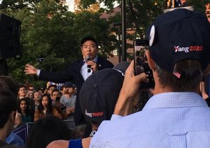 Andrew Yang, one of the Democratic candidates of president, addresses the crowd on Cambridge Common during a campaign stop Monday, Sept. 16, 2019.
