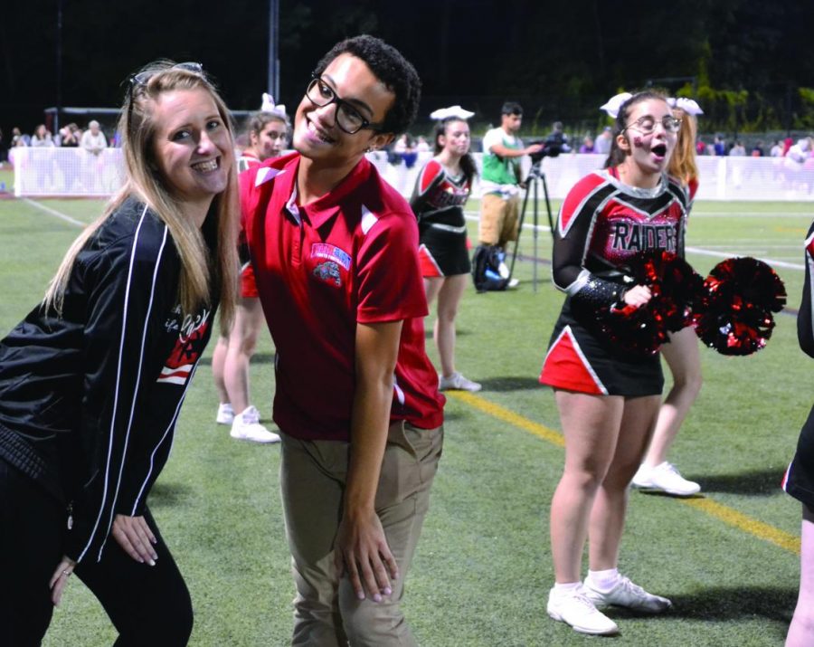 Marcus Moore (center) was a member of Watertown High’s Class of 2019, but continues to help with the cheer
squad.