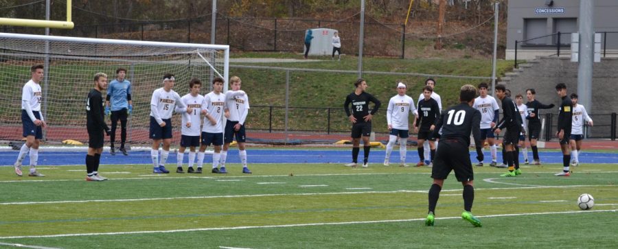 Lynnfield and goalie Dante Gesamondo (15 saves) prepare as Watertowns Arthur Metzker lines up a free kick in the 55th minute of the MIAA Division 3 North semifinals on Monday, Nov. 11, 2019, at St. Johns Prep in Danvers. 
